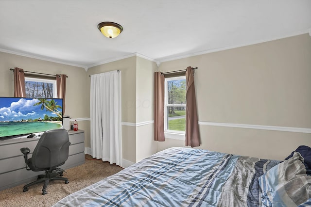 carpeted bedroom featuring crown molding
