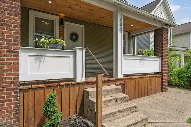238 E Barthman Ave, Columbus, OH 43207 - property entrance featuring covered porch and brick siding