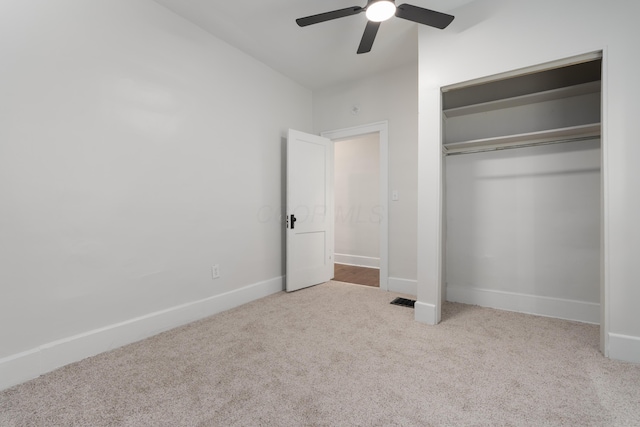 238 E Barthman Ave, Columbus, OH 43207 - unfurnished bedroom with carpet floors, baseboards, ceiling fan, and a closet