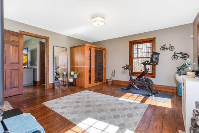 workout area with wood finished floors and baseboards