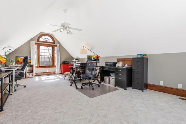 office featuring vaulted ceiling, ceiling fan, light colored carpet, baseboards, and visible vents