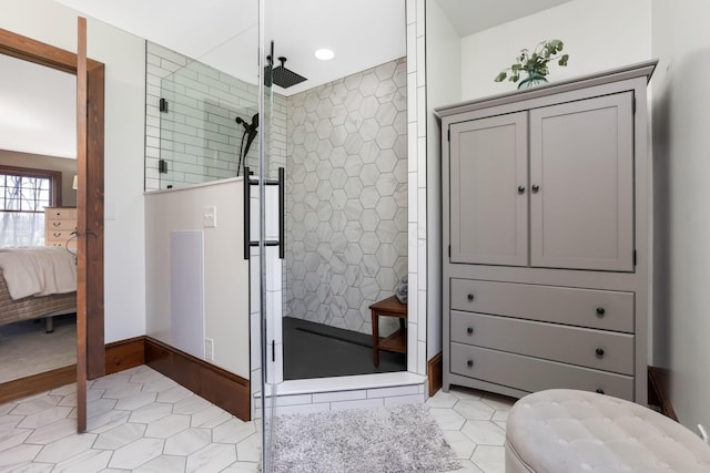 ensuite bathroom with recessed lighting, tile patterned floors, a stall shower, and ensuite bathroom