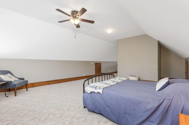 bedroom with lofted ceiling, a ceiling fan, baseboards, and carpet floors