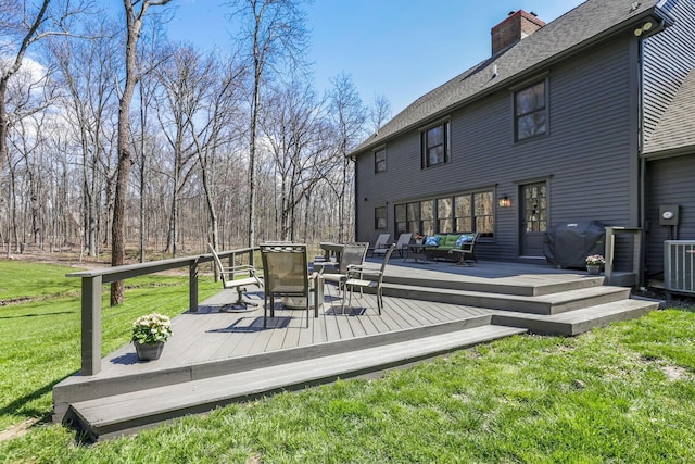 wooden terrace featuring outdoor lounge area and a lawn