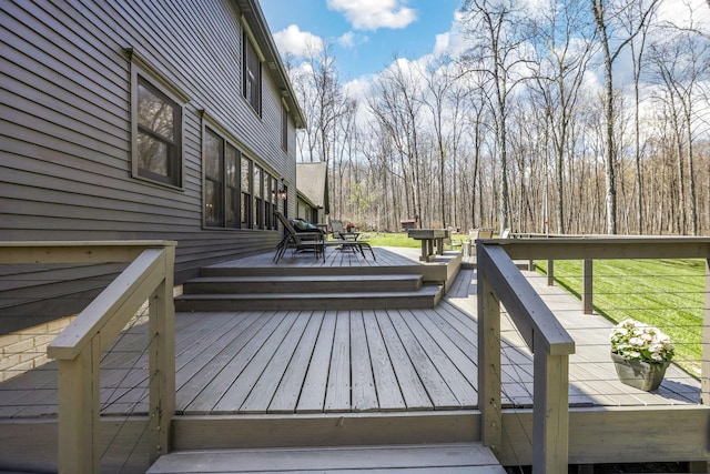 wooden terrace with outdoor dining area
