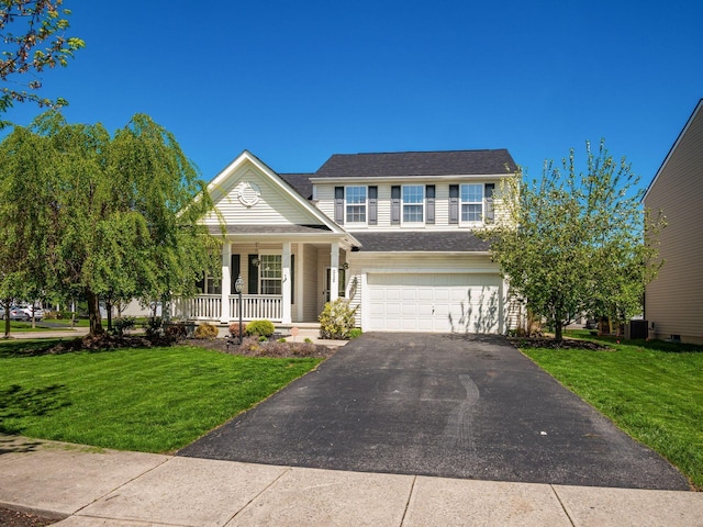 view of front facade featuring a porch, aphalt driveway, a front lawn, and a garage