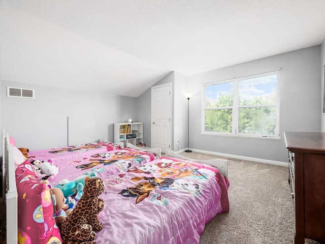 carpeted bedroom with baseboards, visible vents, and vaulted ceiling