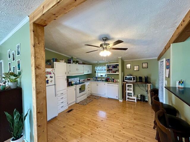 9330 Pidcock Rd, Zanesville, OH 43701 - kitchen with crown molding, a textured ceiling, white appliances, and light wood-type flooring