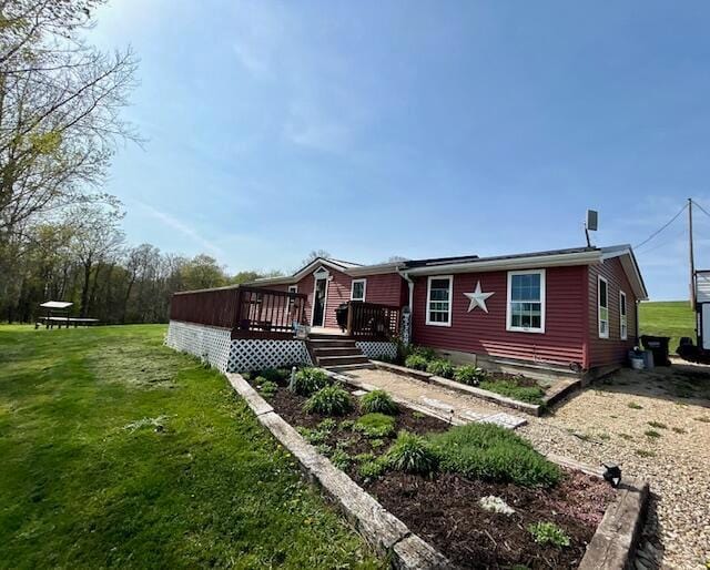 9330 Pidcock Rd, Zanesville, OH 43701 - view of front of home with a wooden deck and a front yard