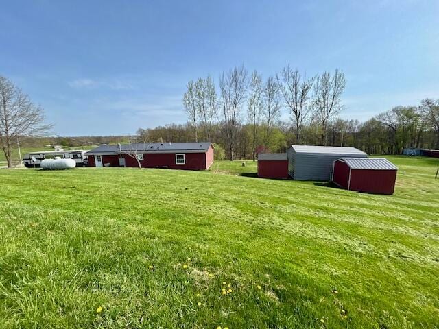9330 Pidcock Rd, Zanesville, OH 43701 - view of yard featuring an outdoor structure and a storage shed