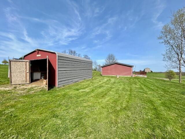 9330 Pidcock Rd, Zanesville, OH 43701 - view of pole building featuring a lawn