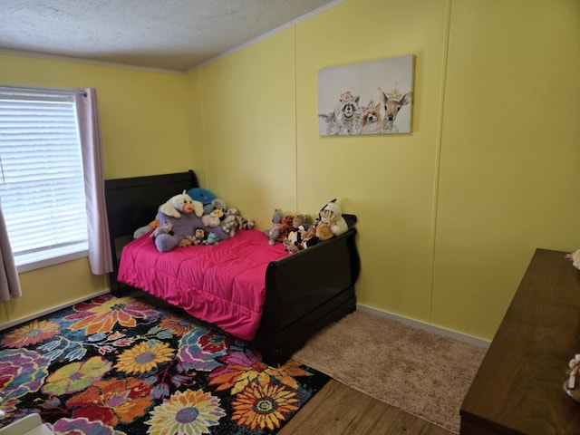 9330 Pidcock Rd, Zanesville, OH 43701 - bedroom featuring a textured ceiling, wood finished floors, multiple windows, and ornamental molding