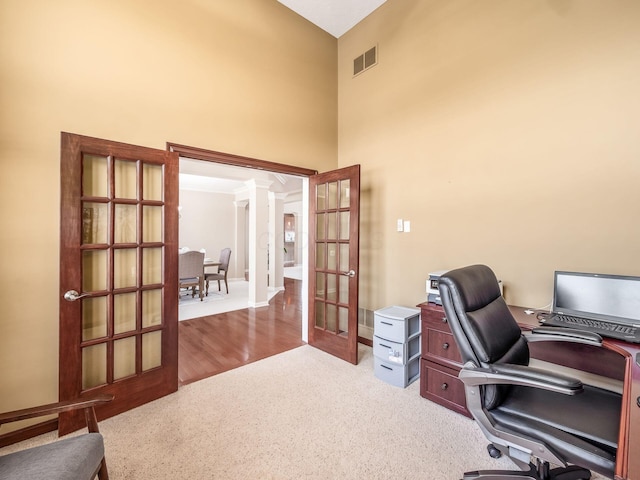 7766 Dickens Ct, Delaware, OH 43015 - carpeted office with french doors, visible vents, a high ceiling, and ornate columns
