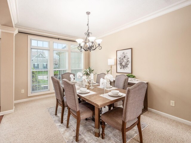 7766 Dickens Ct, Delaware, OH 43015 - dining room with light carpet, baseboards, an inviting chandelier, and crown molding
