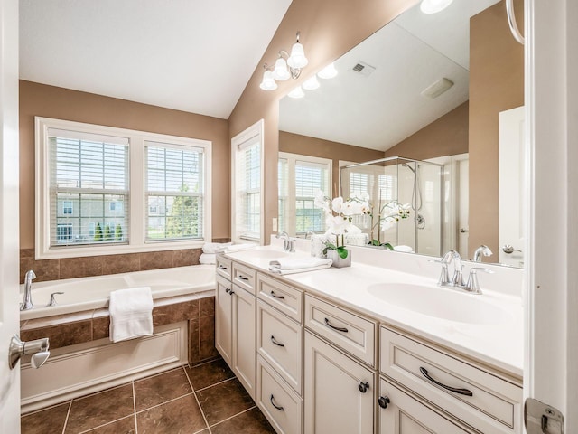 7766 Dickens Ct, Delaware, OH 43015 - bathroom with a bath, a shower stall, vaulted ceiling, and a sink