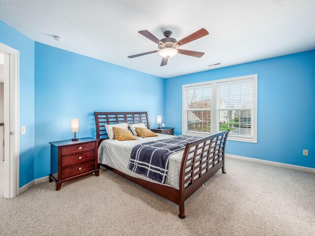 7766 Dickens Ct, Delaware, OH 43015 - bedroom with baseboards, a ceiling fan, visible vents, and carpet flooring