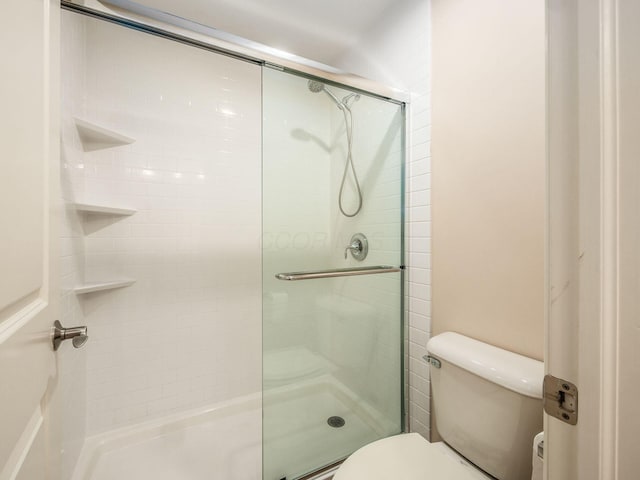 7766 Dickens Ct, Delaware, OH 43015 - bathroom with toilet and a stall shower