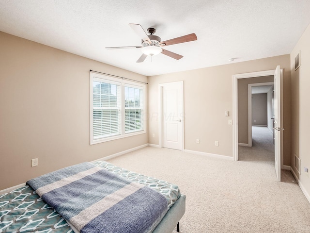 7766 Dickens Ct, Delaware, OH 43015 - bedroom with visible vents, baseboards, ceiling fan, and light colored carpet
