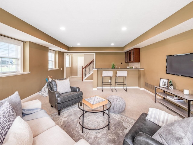 7766 Dickens Ct, Delaware, OH 43015 - living room with baseboards, carpet, visible vents, and stairs
