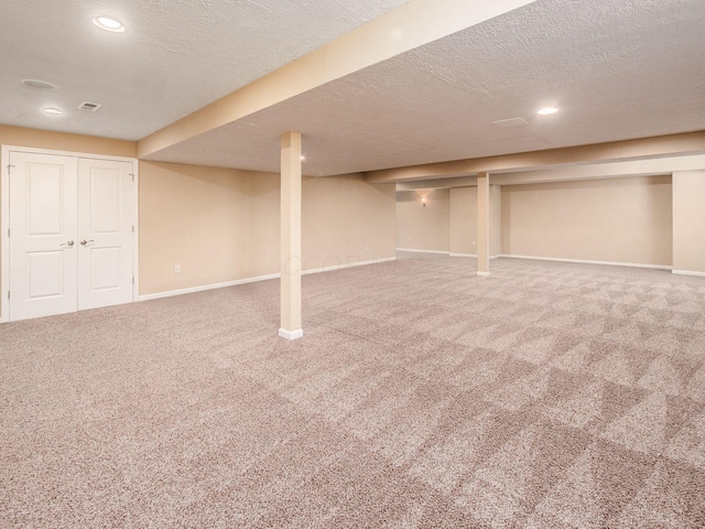 7766 Dickens Ct, Delaware, OH 43015 - finished below grade area with recessed lighting, carpet floors, a textured ceiling, and baseboards