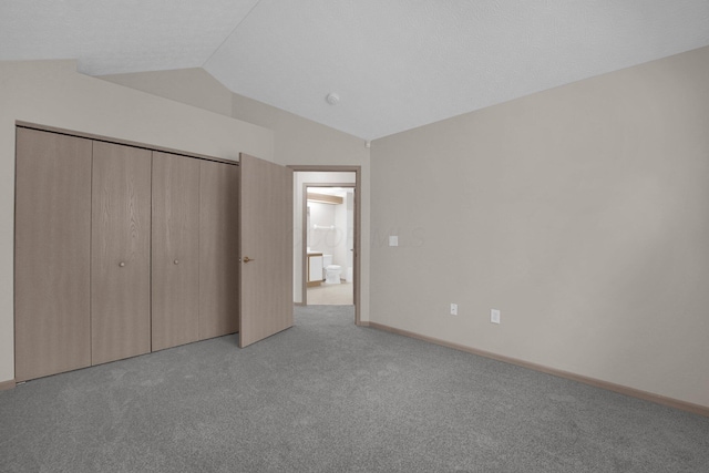 5585 Meadowood Ln, Westerville, OH 43082 - unfurnished bedroom featuring carpet flooring, a closet, baseboards, and lofted ceiling