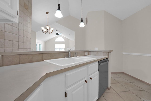 5585 Meadowood Ln, Westerville, OH 43082 - kitchen featuring a sink, dishwashing machine, vaulted ceiling, white cabinetry, and light tile patterned floors