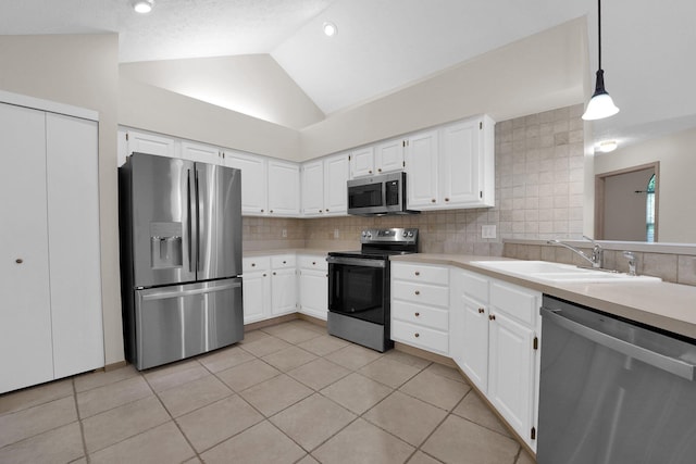5585 Meadowood Ln, Westerville, OH 43082 - kitchen featuring light countertops, appliances with stainless steel finishes, light tile patterned flooring, and a sink