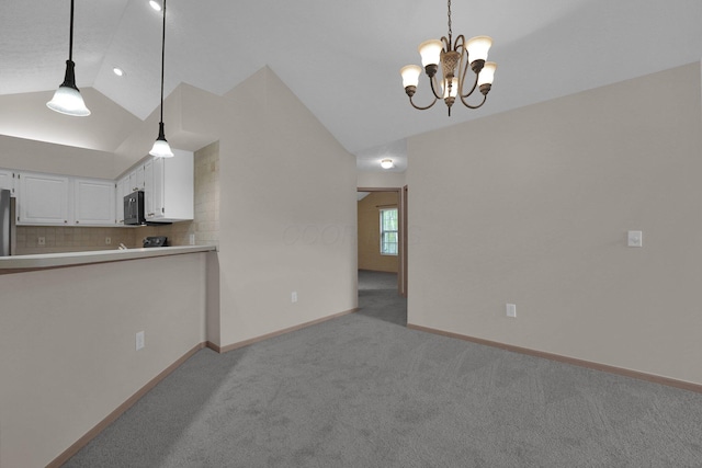 5585 Meadowood Ln, Westerville, OH 43082 - interior space featuring a notable chandelier, vaulted ceiling, baseboards, and light carpet