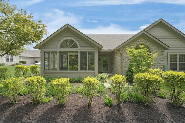 5585 Meadowood Ln, Westerville, OH 43082 - rear view of property featuring roof with shingles and stone siding