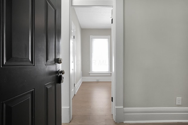 entrance foyer with wood finished floors and baseboards