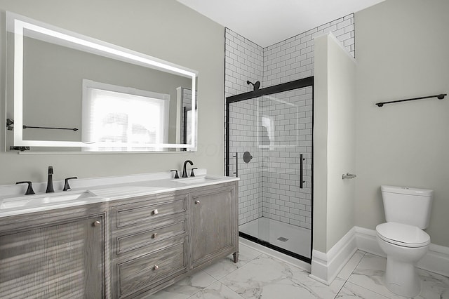 full bathroom with a shower stall, marble finish floor, and a sink