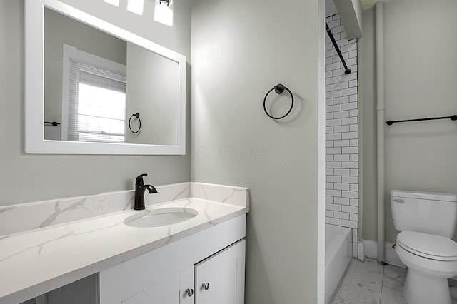 bathroom with bathing tub / shower combination, vanity, marble finish floor, and toilet