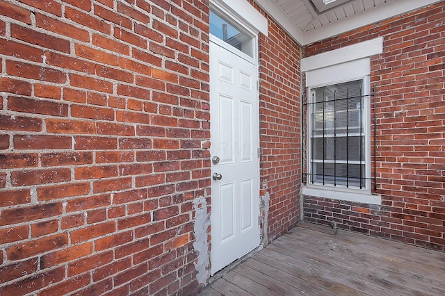 entrance to property with brick siding