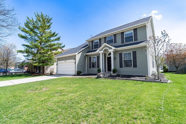 view of front of home with an attached garage, driveway, and a front lawn