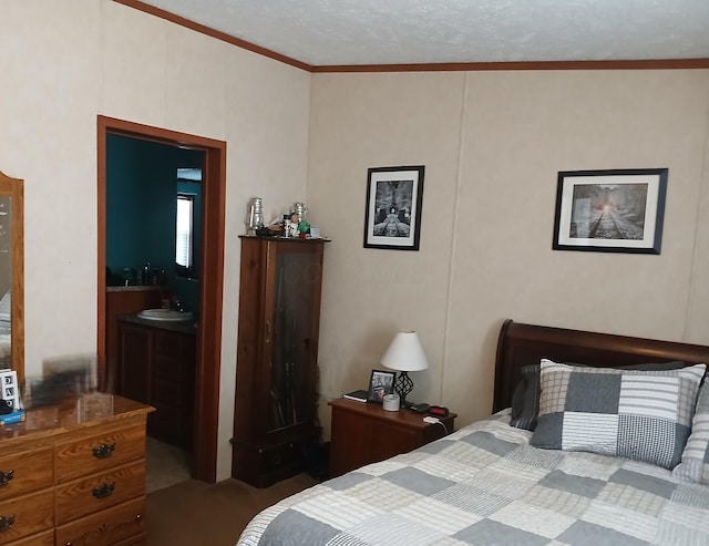 bedroom with carpet floors, connected bathroom, ornamental molding, and a sink
