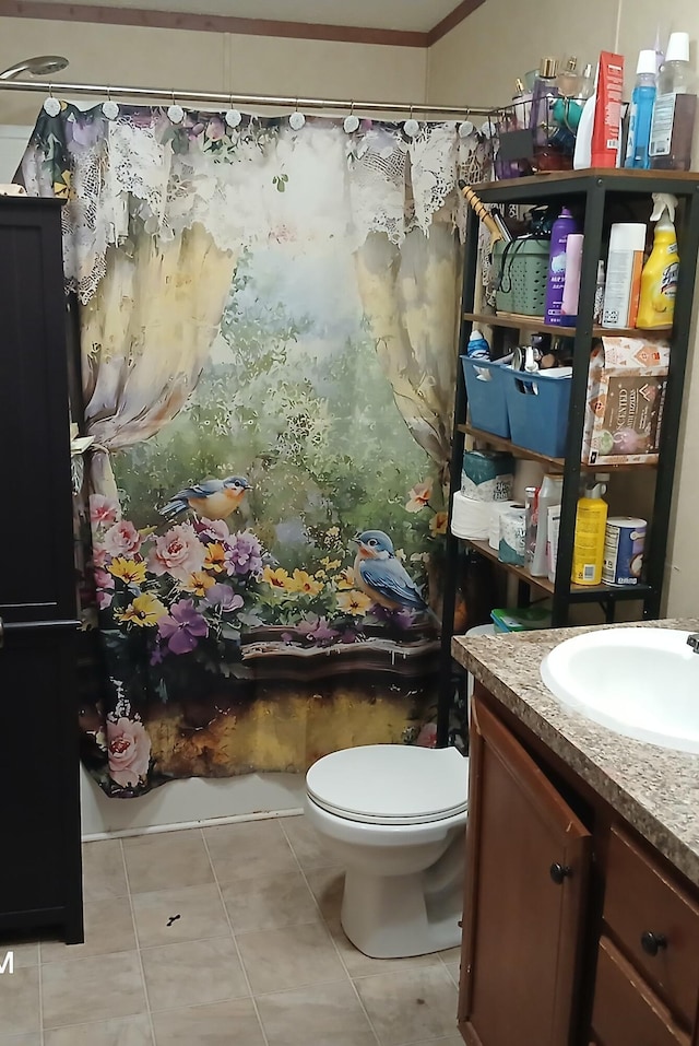 bathroom with curtained shower, tile patterned floors, vanity, and toilet