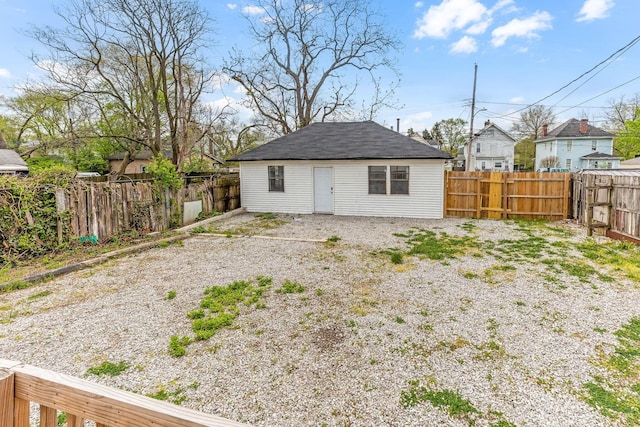 rear view of property with a residential view and a fenced backyard