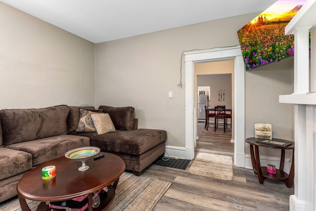 living room with wood finished floors and baseboards