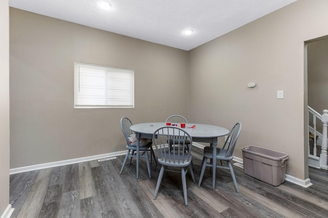 dining space with stairway, wood finished floors, recessed lighting, and baseboards