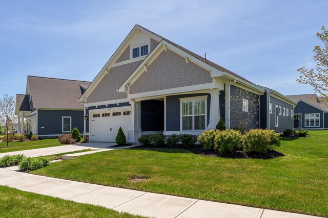 craftsman house with driveway, cooling unit, and a front lawn