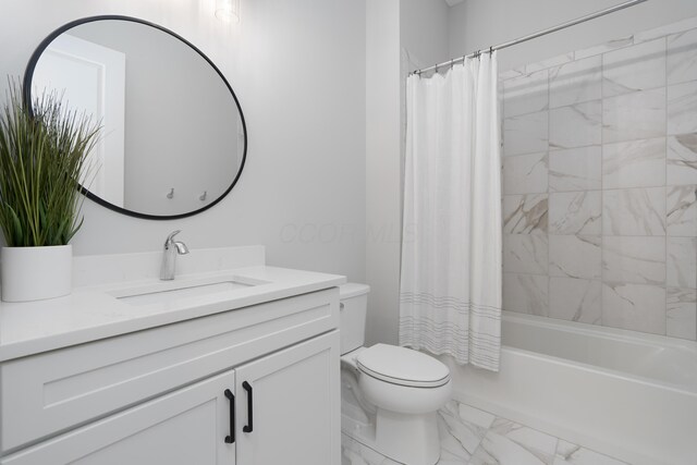 bathroom with vanity, marble finish floor, shower / bath combo, and toilet