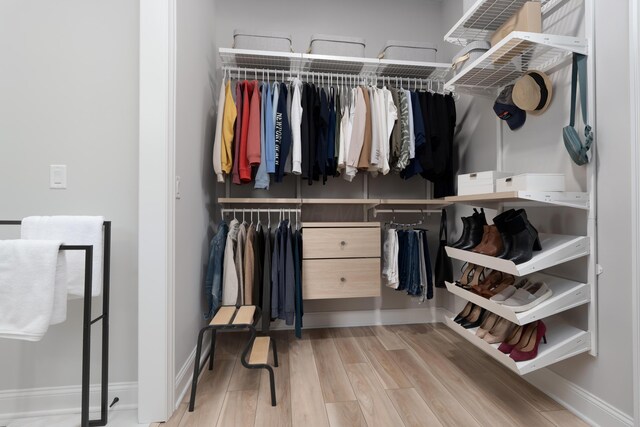 spacious closet with wood finished floors