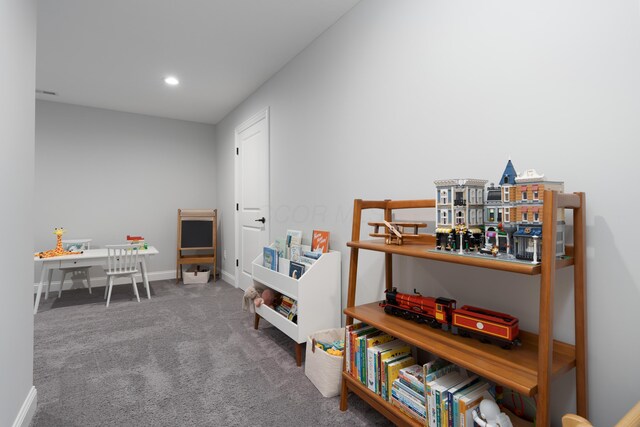 playroom with baseboards, recessed lighting, and carpet