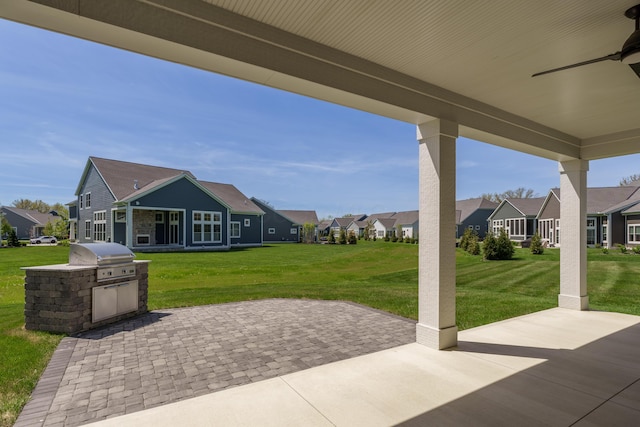 view of patio / terrace with a residential view, grilling area, and area for grilling