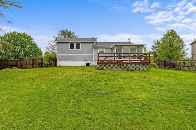 back of house with a wooden deck