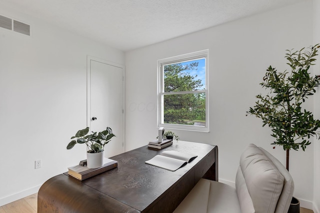 office with baseboards and light wood-type flooring