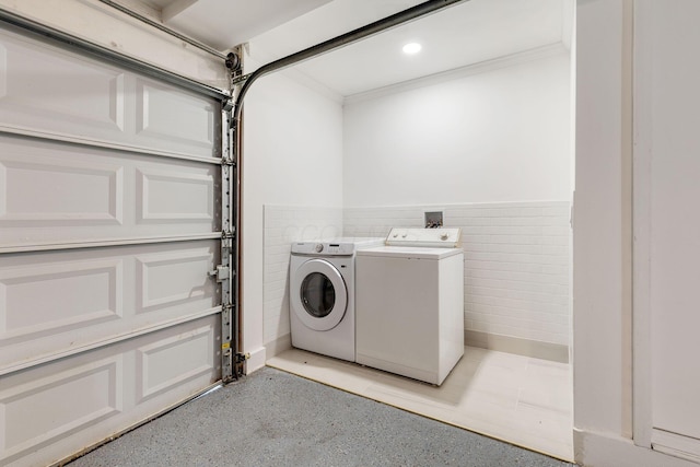 washroom with washing machine and dryer, crown molding, wainscoting, and recessed lighting
