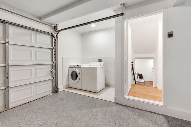 laundry area with washing machine and dryer and recessed lighting