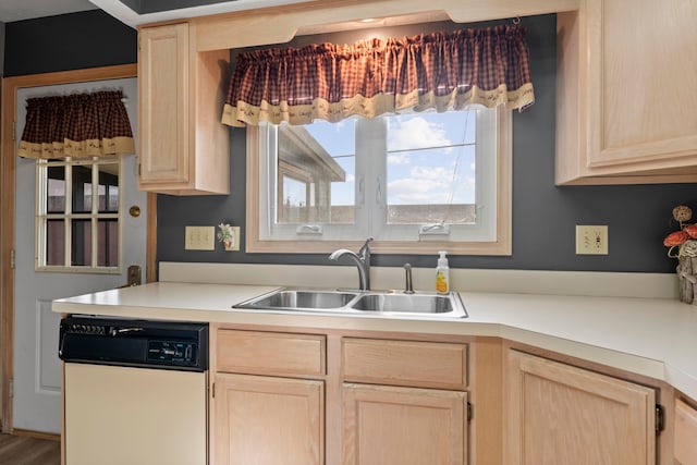 5796 Thada Ln, Columbus, OH 43229 - kitchen with light brown cabinets, white dishwasher, and a sink