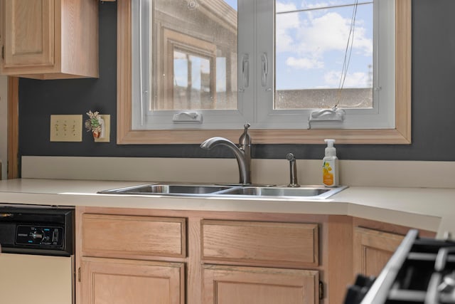 5796 Thada Ln, Columbus, OH 43229 - kitchen with light brown cabinets, a sink, dishwashing machine, and light countertops